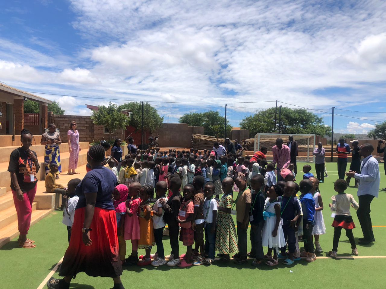 Large group of children assembled on the court